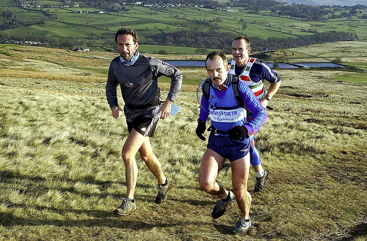 3 runners in a grassfield